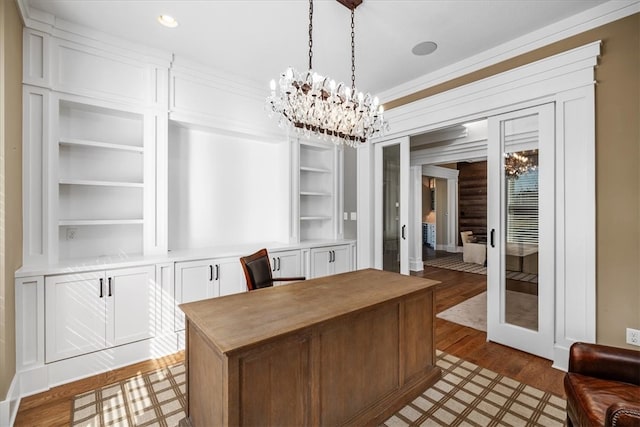 interior space featuring a notable chandelier and wood-type flooring