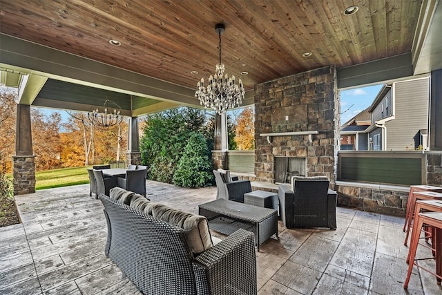 view of patio featuring an outdoor living space with a fireplace