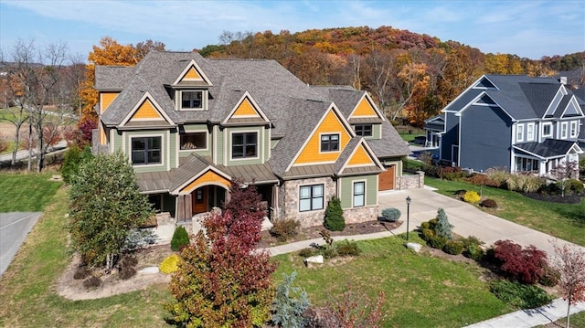 craftsman-style home featuring a front yard