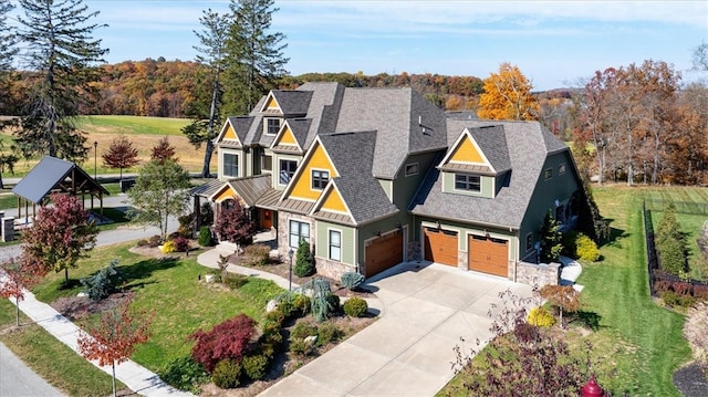 view of front of home featuring a front lawn and a garage