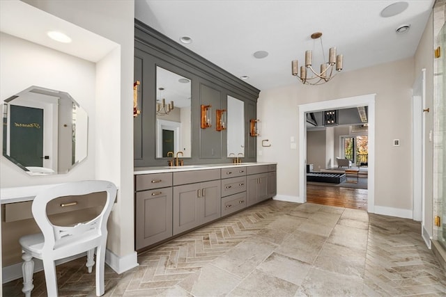 bathroom featuring vanity, hardwood / wood-style floors, and an inviting chandelier