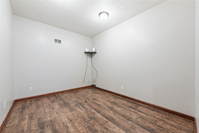 unfurnished room with hardwood / wood-style flooring