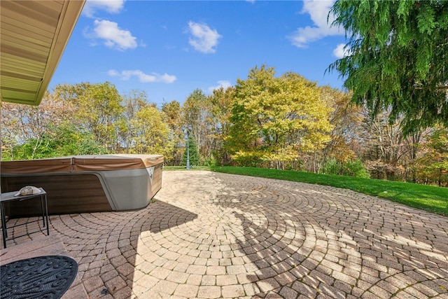 view of patio with a hot tub