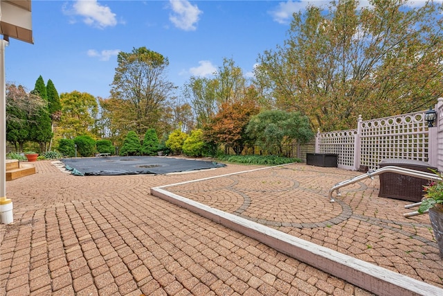 view of patio with a covered pool