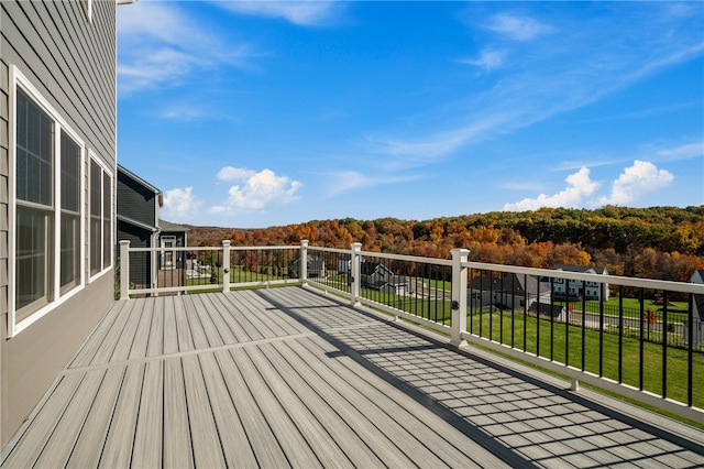 wooden deck with a yard