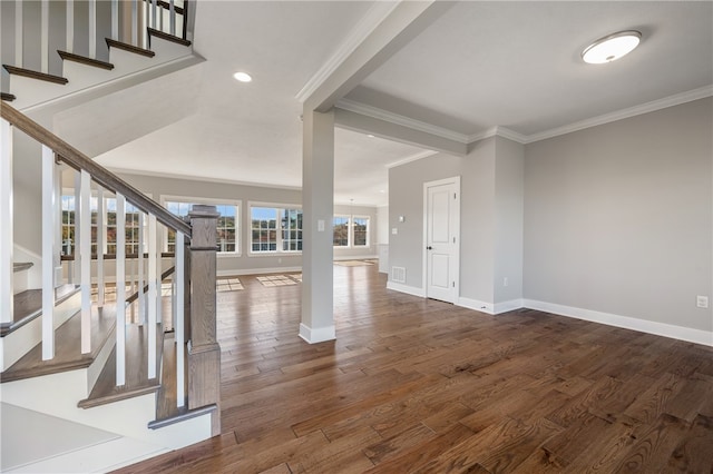 interior space featuring ornamental molding and dark hardwood / wood-style floors