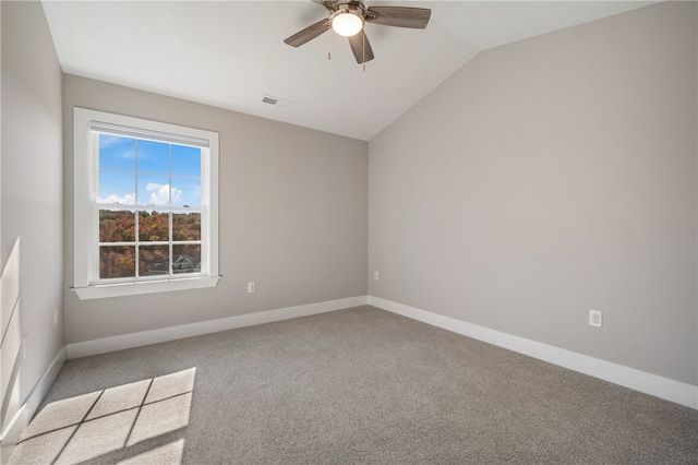 carpeted spare room with lofted ceiling and ceiling fan