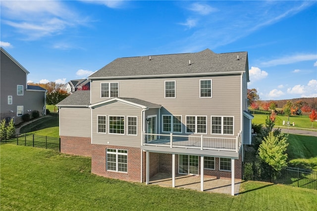 back of house with a lawn