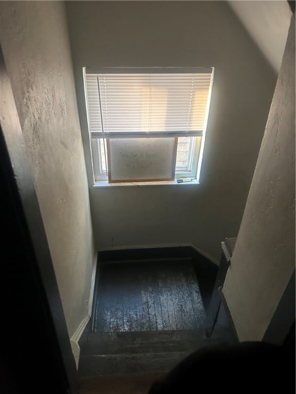 spare room featuring wood-type flooring