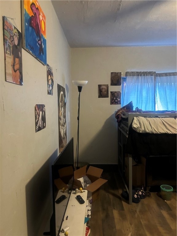 bedroom featuring hardwood / wood-style floors