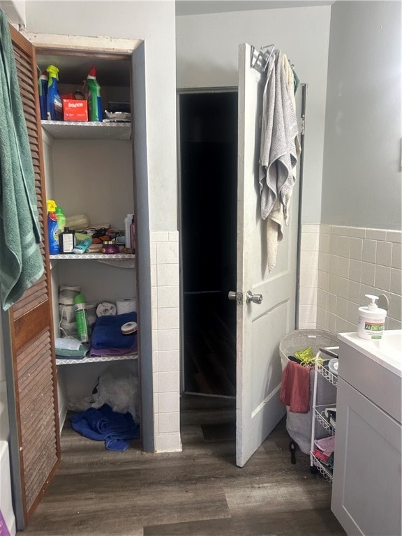 bathroom with vanity and wood-type flooring