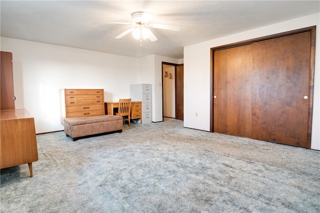 sitting room featuring ceiling fan and light colored carpet