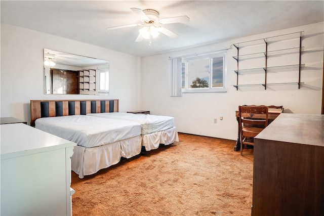 carpeted bedroom featuring multiple windows and ceiling fan