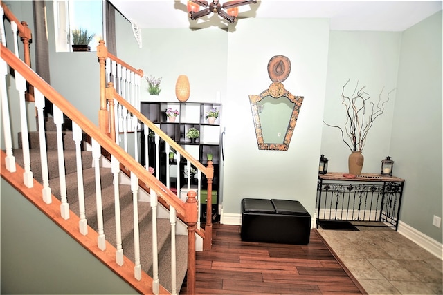 stairway with hardwood / wood-style flooring