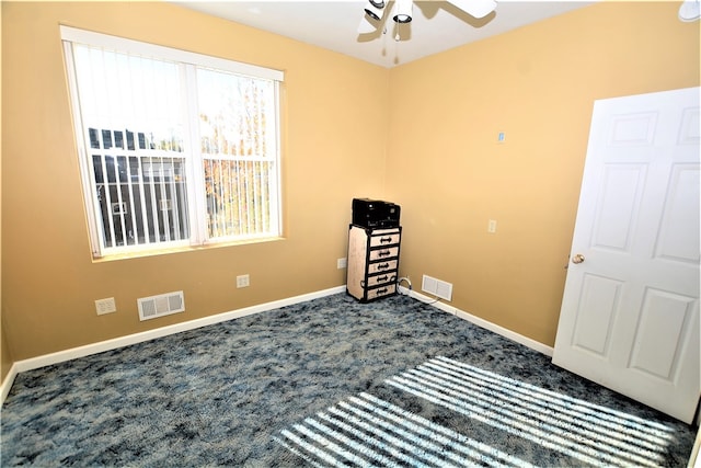 interior space featuring carpet flooring and ceiling fan