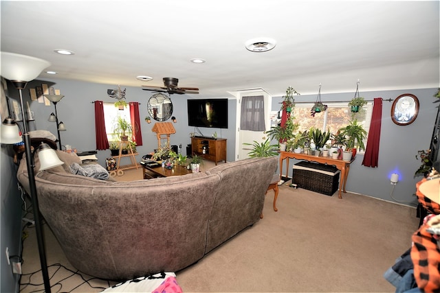 living room with carpet floors and ceiling fan