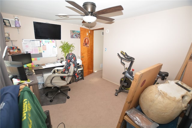 carpeted office with ceiling fan