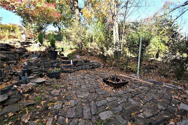 view of patio / terrace featuring a fire pit