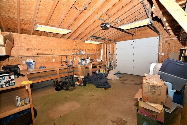 garage featuring a workshop area and a garage door opener