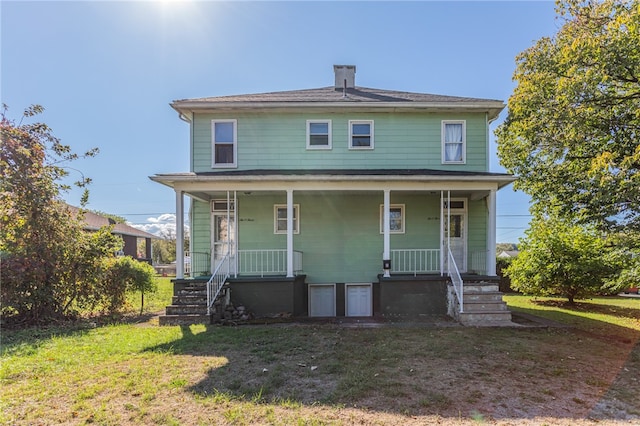 view of front of house with a front lawn and covered porch