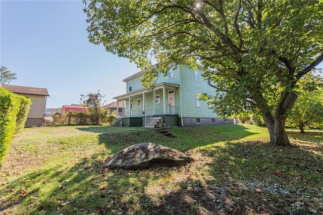 205 Woodlawn Ave, Connellsville, PA 15425 - view of grassy yard with a porch