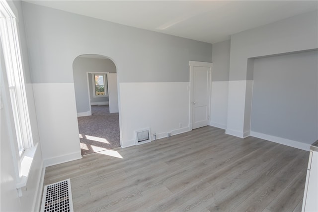 unfurnished room with light hardwood / wood-style flooring