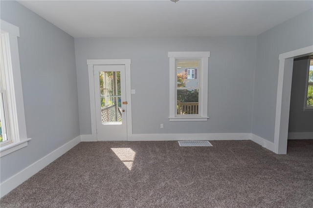 205 Woodlawn Ave, Connellsville, PA 15425 - empty room featuring plenty of natural light, carpet, and baseboards