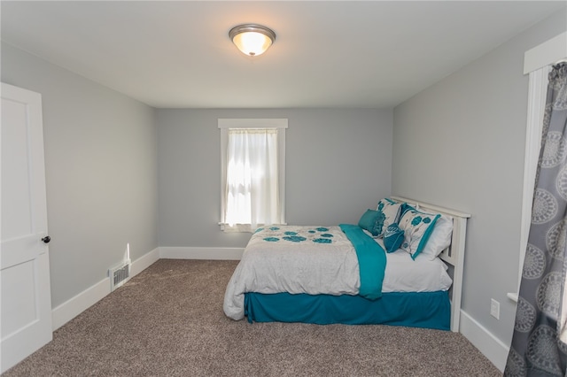 bedroom featuring carpet