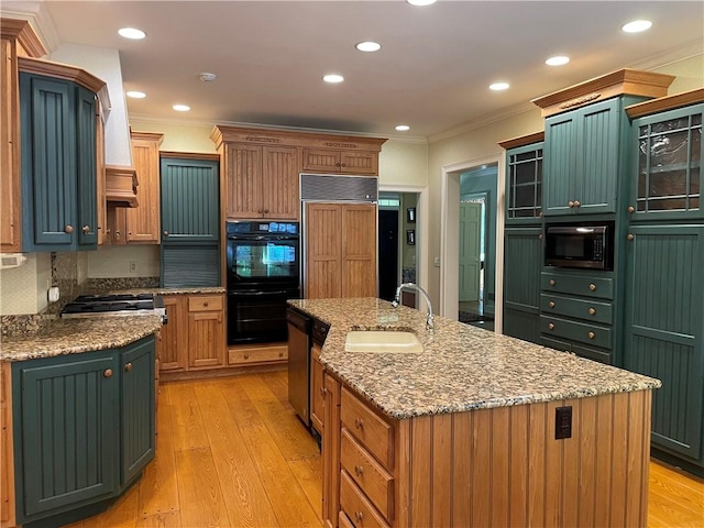 1197 Bankson Rd, Pa, PA 16301 - kitchen with light wood finished floors, an island with sink, a sink, appliances with stainless steel finishes, and ornamental molding