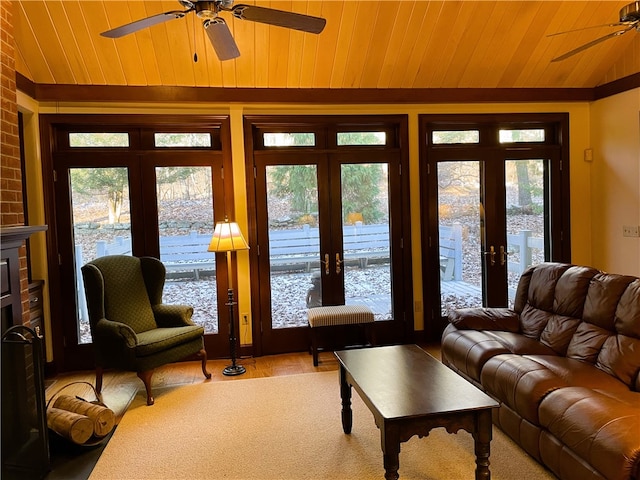 living room featuring french doors, hardwood / wood-style flooring, and wooden ceiling