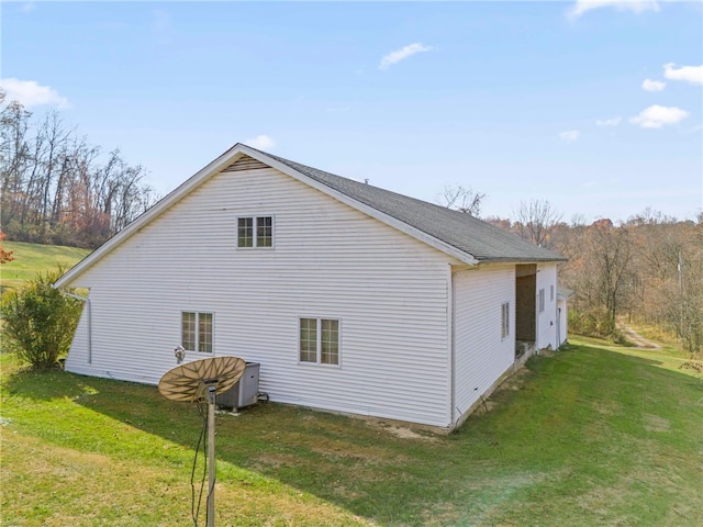 view of property exterior with a lawn