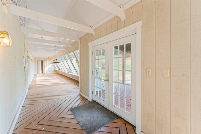 doorway to outside with vaulted ceiling with beams, french doors, and parquet floors