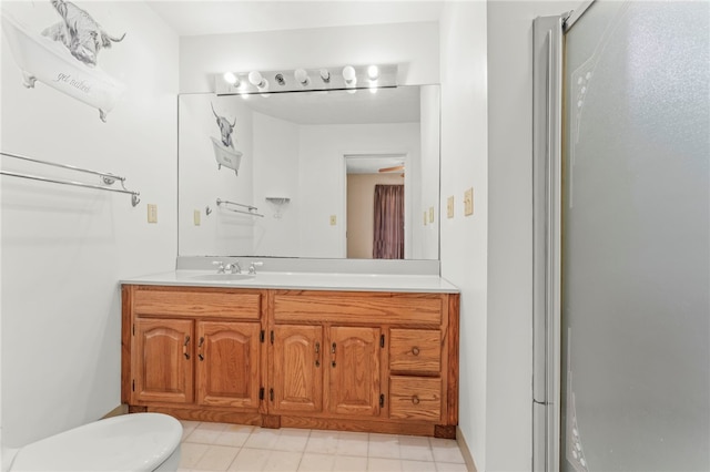 bathroom with vanity and a shower with door