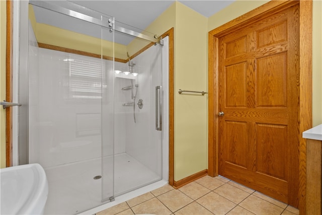 bathroom with tile patterned floors and walk in shower