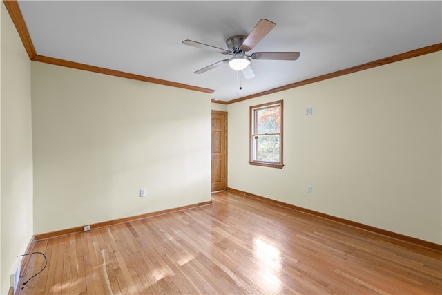 empty room featuring light hardwood / wood-style flooring, ornamental molding, and ceiling fan