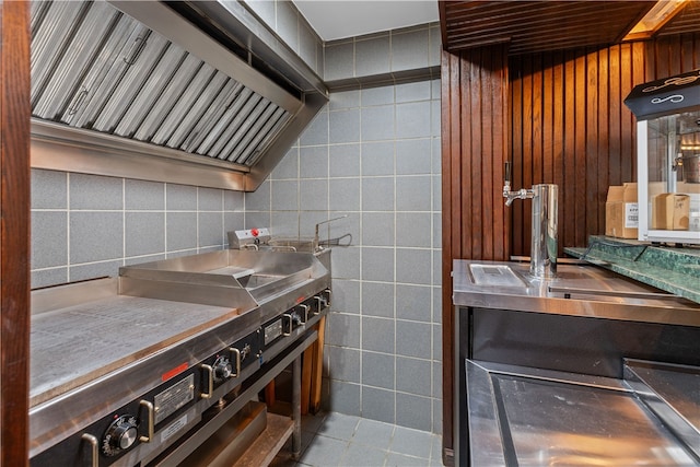 kitchen featuring tile walls and tile patterned flooring