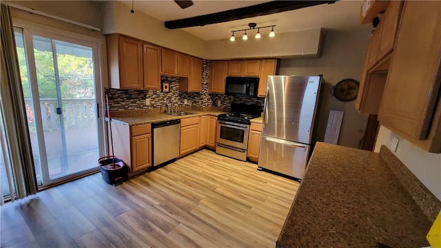 kitchen featuring beam ceiling, light hardwood / wood-style flooring, stainless steel appliances, sink, and tasteful backsplash