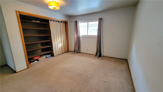 unfurnished bedroom with light carpet