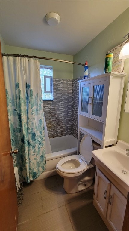 full bathroom featuring vanity, toilet, tile patterned floors, and shower / bath combination with curtain