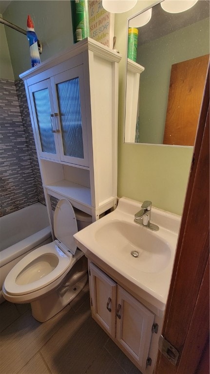 full bathroom featuring vanity, shower / bathing tub combination, toilet, and tile patterned floors