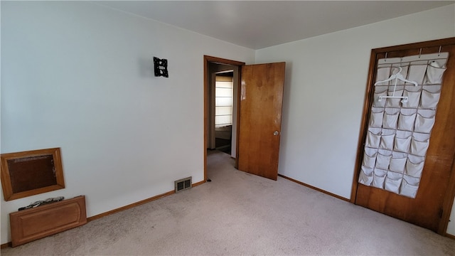 interior space featuring light colored carpet