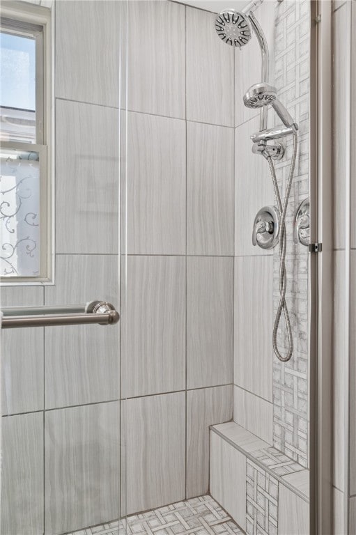 bathroom with tiled shower