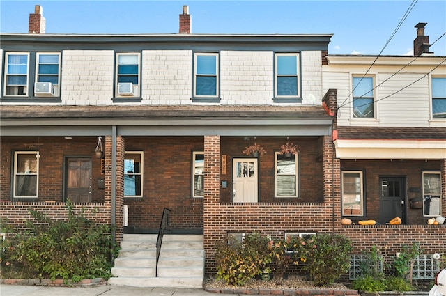 townhome / multi-family property with covered porch