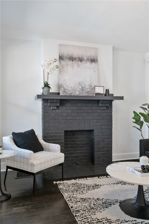 living room featuring a fireplace and wood-type flooring