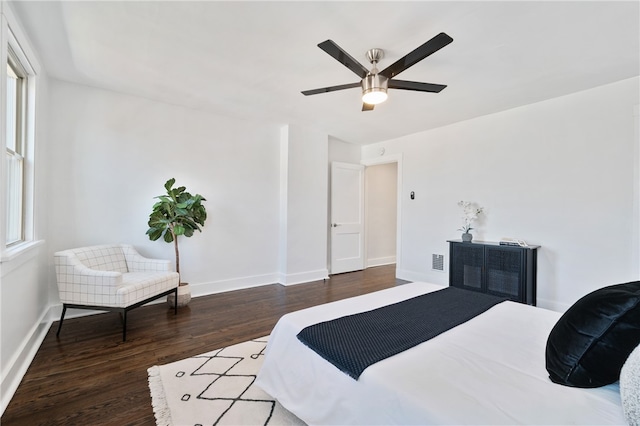 bedroom featuring ceiling fan and dark hardwood / wood-style flooring