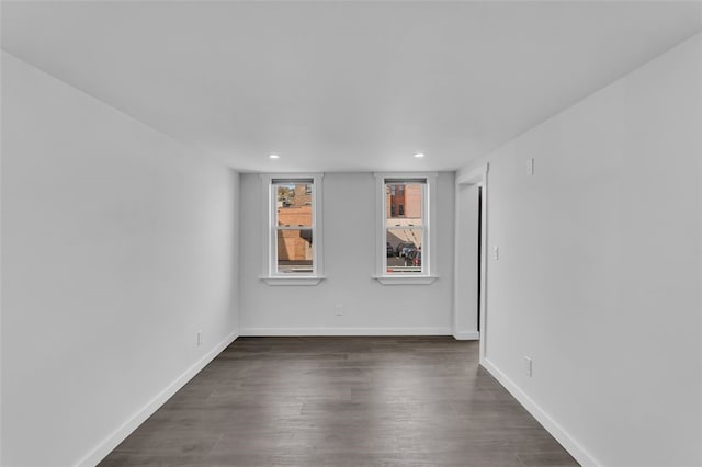 empty room featuring dark hardwood / wood-style floors