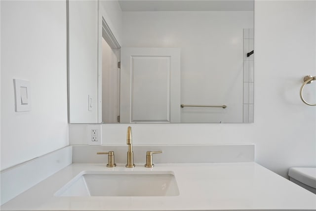 bathroom with toilet and vanity