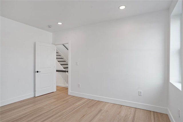 spare room featuring light wood-type flooring