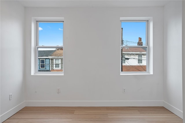 spare room with light hardwood / wood-style floors