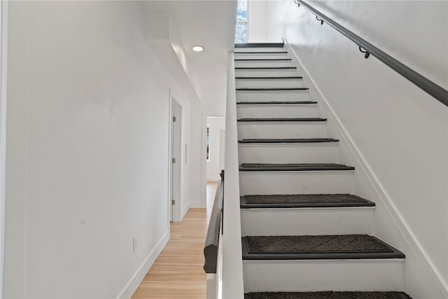 stairs with wood-type flooring